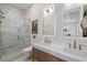 Contemporary bathroom features marble walls, glass shower and and sinks at 71 Moultrie St, Charleston, SC 29403