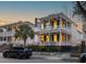 Charming two-story home with double porches, showcasing classic architectural details and curb appeal at 71 Moultrie St, Charleston, SC 29403