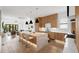Bright, open-concept kitchen with a large island, wood cabinets, modern appliances, and seamless connection to the living area at 71 Moultrie St, Charleston, SC 29403