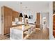 A bright and spacious kitchen with a large center island, modern pendant lighting, and stainless steel appliances at 71 Moultrie St, Charleston, SC 29403