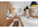 Modern kitchen featuring custom wood cabinets, stainless steel appliances, a large island, and stylish pendant lighting at 71 Moultrie St, Charleston, SC 29403
