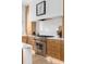 Gourmet kitchen equipped with stainless steel appliances, custom wood cabinets, and white countertops perfect for cooking at 71 Moultrie St, Charleston, SC 29403