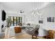 Bright living room with modern furniture, a fireplace, and doors leading to a pool creating an inviting atmosphere at 71 Moultrie St, Charleston, SC 29403