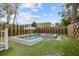 Backyard pool and hot tub surrounded by lush landscaping and privacy fence at 71 Moultrie St, Charleston, SC 29403