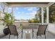 Comfortable covered porch with seating area, perfect for enjoying the outdoors and views of the surrounding neighborhood at 71 Moultrie St, Charleston, SC 29403