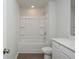 Bathroom featuring white tub-shower combo, toilet and vanity with hard surface countertop at 740 Meadowbrook Lane, Summerville, SC 29486