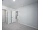 Bedroom featuring neutral walls and carpet, with doors leading to closet and hallway at 740 Meadowbrook Lane, Summerville, SC 29486