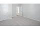 Bright, carpeted bedroom showcasing a double door closet and open doorway to a connecting space at 740 Meadowbrook Lane, Summerville, SC 29486