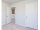 Bedroom featuring neutral walls and carpet, with doors leading to closet and hallway at 740 Meadowbrook Lane, Summerville, SC 29486