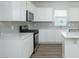 Modern kitchen featuring stainless steel appliances, gray backsplash, quartz countertops, and ample cabinetry at 740 Meadowbrook Lane, Summerville, SC 29486