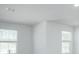Bright living room with neutral walls and two windows providing ample natural light at 740 Meadowbrook Lane, Summerville, SC 29486