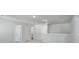 Open loft area with white walls, carpet, and multiple doors at 740 Meadowbrook Lane, Summerville, SC 29486