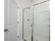 Modern bathroom featuring a glass-enclosed shower with white tile surround at 740 Meadowbrook Lane, Summerville, SC 29486