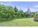 Idyllic backyard pond surrounded by lush greenery, creating a serene and private outdoor space at 7812 Park Gate Dr, North Charleston, SC 29418
