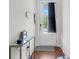 Entryway featuring a white door with glass panel, hardwood floors and table at 7812 Park Gate Dr, North Charleston, SC 29418