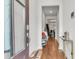 Inviting entryway with hardwood floors, light walls, and secure keypad entry, showcasing modern touches at 7812 Park Gate Dr, North Charleston, SC 29418