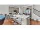 Open kitchen with white countertop island, stainless steel appliances, and ample storage space at 7812 Park Gate Dr, North Charleston, SC 29418