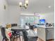 Open concept living space featuring hardwood floors, natural light, and seamless transition to the dining area at 7812 Park Gate Dr, North Charleston, SC 29418