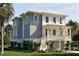 Charming coastal home with a metal roof, a welcoming front porch, and well-maintained landscaping at 8266 Jack Island Dr, Johns Island, SC 29455