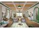 Elegantly decorated living room with stylish furniture, beautiful archways, and natural light at 8266 Jack Island Dr, Johns Island, SC 29455