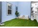 Inviting backyard patio with synthetic grass and comfortable outdoor seating, perfect for relaxation at 8604 Bowen Corner Ave, Hanahan, SC 29410