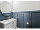 Bathroom with board and batten walls, modern sink, decorative mirror and fixtures at 8604 Bowen Corner Ave, Hanahan, SC 29410