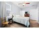 Well-lit bedroom with ceiling fan, natural light, and comfortable furnishings at 8604 Bowen Corner Ave, Hanahan, SC 29410