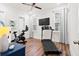 Exercise room features a treadmill, exercise bike, ceiling fan and natural light from windows at 8604 Bowen Corner Ave, Hanahan, SC 29410