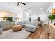 Comfortable living room with a gray sectional sofa, hardwood floors, and open floor plan, perfect for relaxation at 8604 Bowen Corner Ave, Hanahan, SC 29410