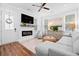 Cozy living room featuring a modern fireplace, built-in shelving, and comfortable seating, creating a warm ambiance at 8604 Bowen Corner Ave, Hanahan, SC 29410