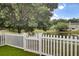 Beautiful backyard with picket fence and tranquil pond view, perfect for relaxation at 1005 Washitonia Way # B, Charleston, SC 29492