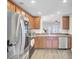 Modern kitchen featuring stainless steel appliances, dark wood cabinetry, and sleek countertops with an open layout for easy entertaining at 1005 Washitonia Way # B, Charleston, SC 29492