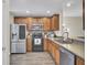 Charming kitchen featuring stainless steel appliances, wooden cabinetry, and updated countertops, perfect for cooking and entertaining at 1005 Washitonia Way # B, Charleston, SC 29492