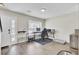 A well-lit living space featuring sleek flooring, a dedicated workstation, and modern decor, offering a comfortable and functional area at 1005 Washitonia Way # B, Charleston, SC 29492