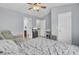 This main bedroom features neutral paint, ceiling fan, ensuite bathroom, and a baby station at 1005 Washitonia Way # B, Charleston, SC 29492