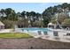 A refreshing community pool area features lounge chairs, perfect for relaxing under the sun at 1005 Washitonia Way # B, Charleston, SC 29492