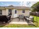 Backyard patio features outdoor seating and grill, perfect for entertaining and enjoying outdoor meals at 102 Jasimine Ct, Summerville, SC 29486
