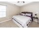 Comfortable bedroom featuring a tray ceiling, neutral walls, carpet, and natural light from a window at 102 Jasimine Ct, Summerville, SC 29486