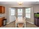 Dining area with wood table and chairs next to a three piece bay window at 102 Jasimine Ct, Summerville, SC 29486