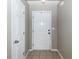 Clean entryway with a neutral wall color, ceramic tile flooring, and a white front door at 102 Jasimine Ct, Summerville, SC 29486