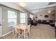 Well lit kitchen, dining area, and living room with neutral colored walls and tile floors at 102 Jasimine Ct, Summerville, SC 29486