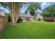 Large backyard with covered porch and patio furniture at 105 Corral Cir, Summerville, SC 29485