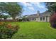 Large backyard with a green lawn and a patio seating area at 105 Corral Cir, Summerville, SC 29485