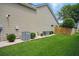 Well-maintained backyard with green grass and a wooden privacy fence at 105 Corral Cir, Summerville, SC 29485