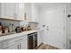 Home bar area with beverage cooler, ample countertop space, and modern cabinets at 105 Corral Cir, Summerville, SC 29485
