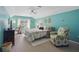 Cozy bedroom with a ceiling fan, comfortable armchair, and a small dining area near the bright window at 105 Corral Cir, Summerville, SC 29485
