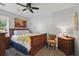 Cozy bedroom features hardwood furniture, ceiling fan, and neutral decor, offering a comfortable and inviting space at 105 Corral Cir, Summerville, SC 29485