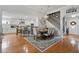Dining area with hardwood flooring that opens to the kitchen with white cabinets at 105 Corral Cir, Summerville, SC 29485