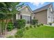 Landscaped garden bed with mature shrubbery along the side of the home at 105 Corral Cir, Summerville, SC 29485