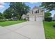 View of the home's two car garage and long driveway at 105 Corral Cir, Summerville, SC 29485